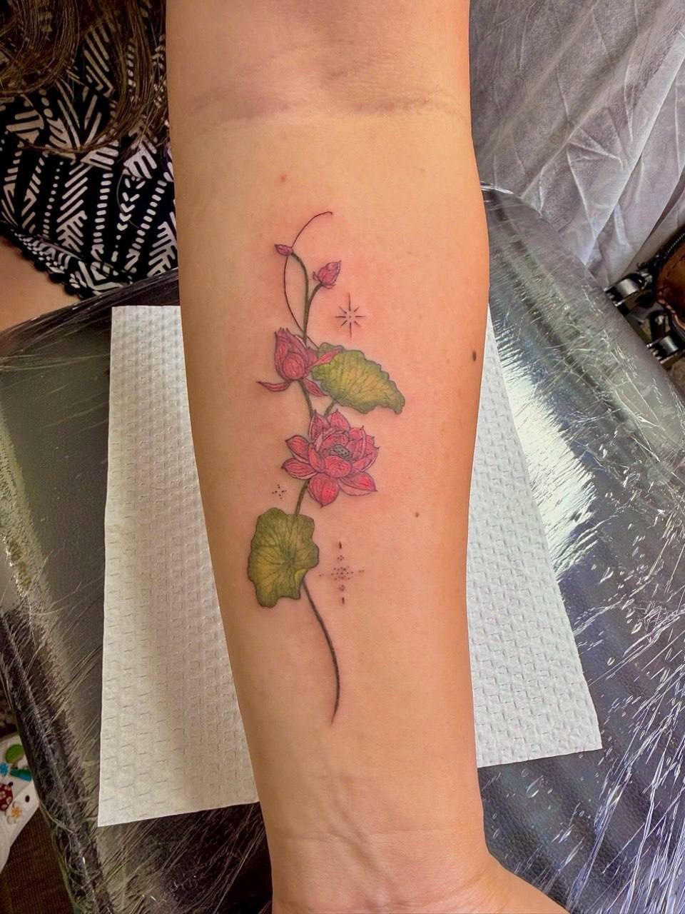 Color lotus flower forearm tattoo - Sisters Ink Tattoo Studio Da Nang